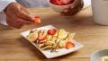 Banana cooked crepes with Nutella® and nuts